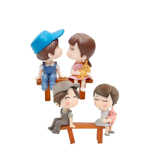 Teenage couple sitting on bench Set of 2