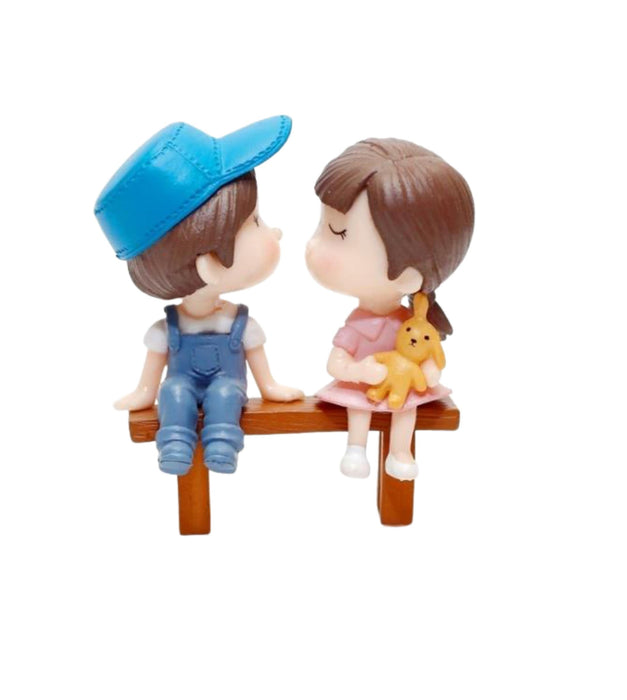 Teenage couple sitting on bench